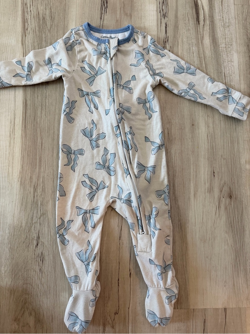 Cozy Bow-Print Footed Pajamas - Cream with Light Blue Bows